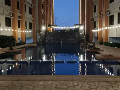 a pool of water in the middle of a building at Paseo Verde Condominium in Manila