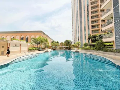 a large swimming pool in the middle of a building at Luxury BGC Condo, Venice Grand Canal #vlrtc5h in Manila