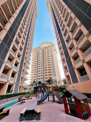 a playground with a slide in front of a large building at Luxury Bgc Condo Near Venice Mall #vlra22e in Manila