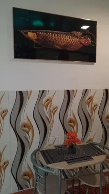 a picture of a table with a fish on the wall at SMDC Fame Marcelle's Place near Mega Mall in Manila