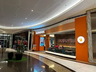 a mall with a shopping center with a store at 1BR w/ Balcony near Megamall: The Admiral‘s Lounge in Manila
