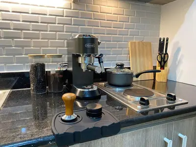 a coffee maker on a counter in a kitchen at 1BR w/ Balcony near Megamall: The Admiral‘s Lounge in Manila