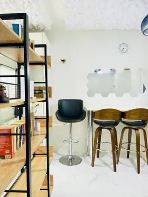 two chairs and a table in a room at Modern Simplicity: Cozy @Nuvali in Pitland