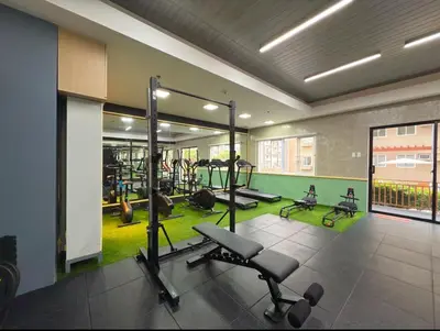 a gym with treadmills and exercise equipment in a building at Modern Simplicity: Cozy @Nuvali in Pitland