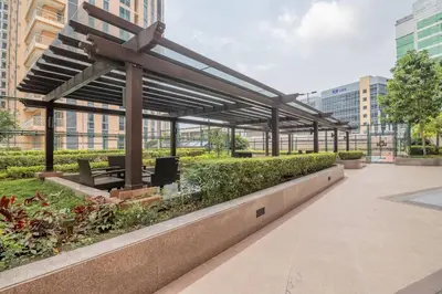 a pavilion in the middle of a city with buildings at Studio at Venice Mall, near Airport, BGC & Makati in Manila