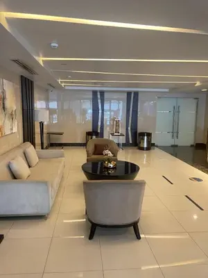 a living room with a couch and a table at 8 Adriatico in Manila