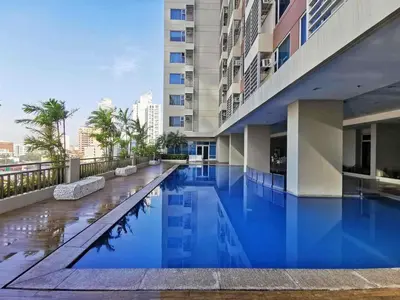 a swimming pool in the middle of a building at 8 Adriatico in Manila