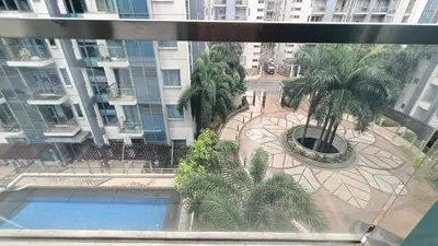 a view of a courtyard with palm trees in a building at 1 bedroom Condotel near Terminal3 Airport in Manila