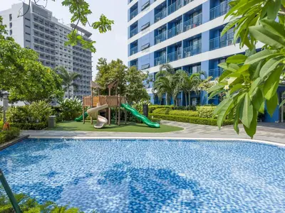 a swimming pool with a slide and a playground at GemstoneBR in SMDC Air Residences in Manila