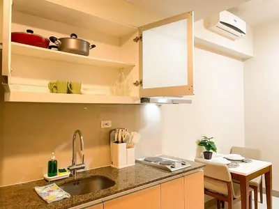 a kitchen with a sink and a counter top at Chillhive Condo In Bgc Near Uptown Mall #ournw17a in Manila