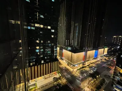 an aerial view of a city at night at Chillhive Condo In Bgc Near Uptown Mall #ournw17a in Manila