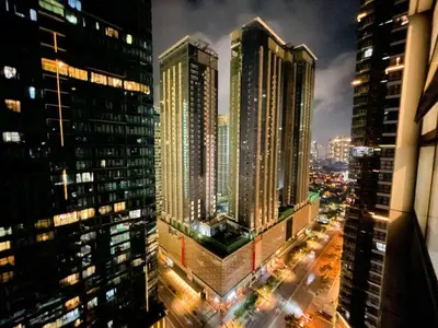 a view of a city at night with tall buildings at Premium Bgc Staycation, Uptown Area #ournw27b in Manila