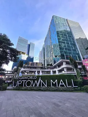 a sign in front of a large building at Bgc Condo Near Uptown Mall, Grand Hyatt #ournw25b in Manila