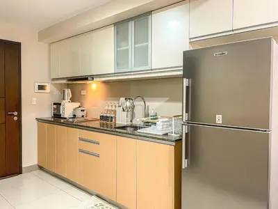 a kitchen with a stainless steel refrigerator and cabinets at Bgc Prime, Near Uptown Mall, Grand Hyatt #ournw7m in Manila