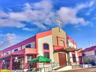a church with a cross on top of it at Romantic 2BR Condo unit with free WiFi in Anabu Primero