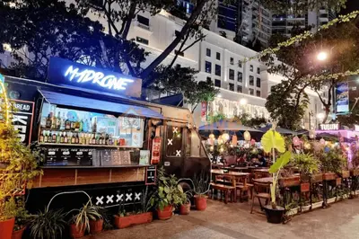 a food truck parked in front of a restaurant at Bgc Staycation Across Uptown Mall #oursw29f in Manila