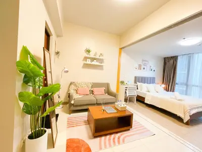 a living room with a couch and a table at Luxury BGC Condo, Steps to Uptown Mall #oursw31i in Manila