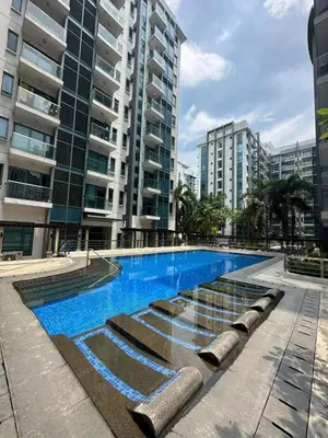 a swimming pool in a city with tall buildings at Runway Walk Studio - Near NAIA Terminal3 in Manila
