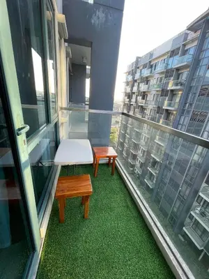 two benches on the balcony of a building at Runway Walk Studio - Near NAIA Terminal3 in Manila