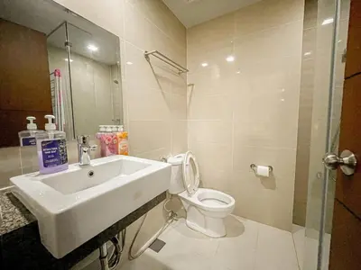 a bathroom with a sink and a toilet at Prime Bgc Stay Near Uptown, Grand Hyatt #oursw18j in Manila