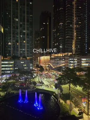 a view of a city at night with a fountain at Prime Bgc Stay Near Uptown, Grand Hyatt #oursw18j in Manila