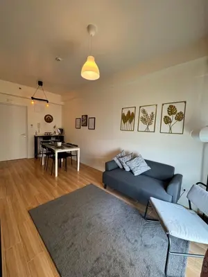 a living room with a couch and a table at K&K The Modern Crib at Holland Park Condo Southwoods City in Biñan