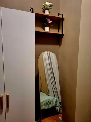 a mirror in a cupboard with a mirrorigunigunigun at Serene Suite In Jazz Residences in Manila