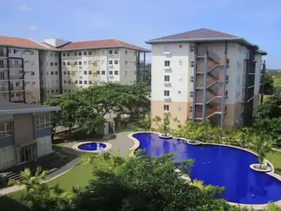 an overhead view of a resort with a pool and buildings at Serenity in Style: Scandinavian Zen in Nuvali in Pitland