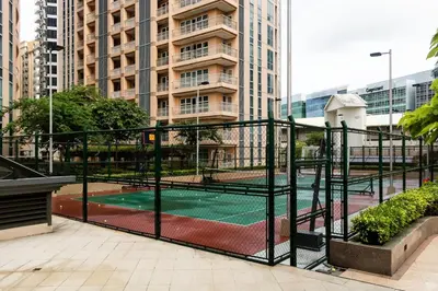 a tennis court in the middle of a city at Amazing Sunrise Venice Grand Canal Balcony, Xbox Series X console with Game Pass Ultimate, FREE coffee, Pool, Gym & Sauna, 5 mins to BGC in Manila
