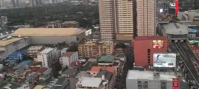 an overhead view of a city with tall buildings at JJMC HOMESTAY 32 With Netflix and Unli Wifi in Manila