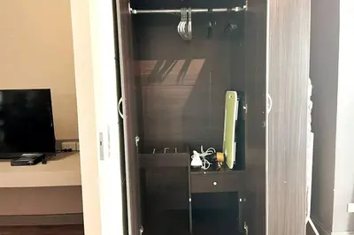 a glass door of a bathroom with a mirror at 1BR with Balcony KL Tower, Greenbelt near AIM in Manila