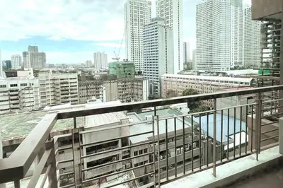 a view of a city from the balcony of a building at 1BR with Balcony KL Tower, Greenbelt near AIM in Manila