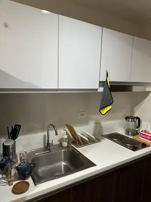 a kitchen with a sink and a counter top at My Hideaway@Air in Manila