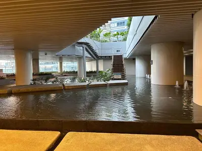 a large building with a pool of water in a building at My Hideaway@Air in Manila