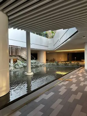 a large building with a river in the middle of it at My Hideaway@Air in Manila