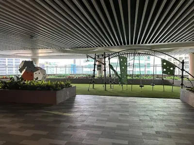 a building with a large ceiling and a green field at My Hideaway@Air in Manila