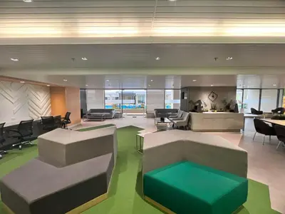 an office with a lobby with chairs and tables at SMDC Green 2 Staycation, The Traditional & Modern Fusion Condo in Pasong Bayog