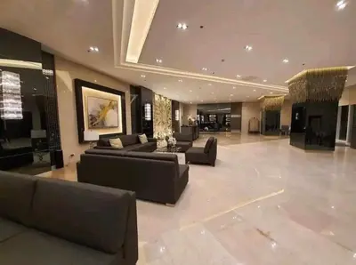 a large living room with couches and a table at Fame Residences 1 bedroom near MRT, Shaw, Megamall, Shangrila, Ortigas 1401 in Manila