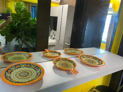 a group of plates sitting on top of a table at Laugh and Lounge 2 Bedroom Luxury Condo Air residence Makati in Manila