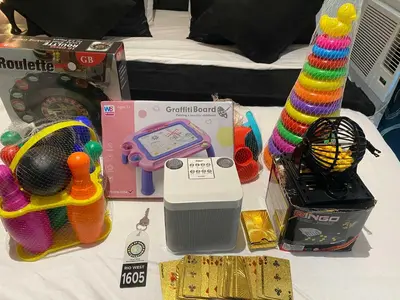 a table with toys and a toy generator on it at Azure skyview 1BR netflix karaoke ps3 Airport in Manila