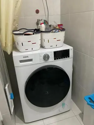a washing machine with three baskets on top of it at Cookies Nest at 100West Makati in Manila