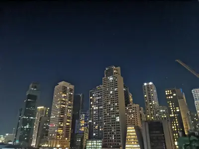 a city skyline at night with tall buildings at Condo UNIT-SM JAZZ RESIDENCES in Manila