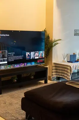 a living room with a large flat screen tv at BGC 3BR Uptown Parksuites with bathtub 16 in Manila
