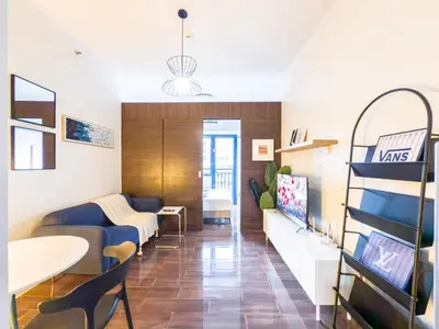 a living room with a couch and a table at GemstoneBR II@SMDC Air Residences in Manila