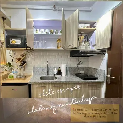 a kitchen with a sink and a counter top at ALABANG STUDIO unit w/ high speed Fiber WIFI in Manila