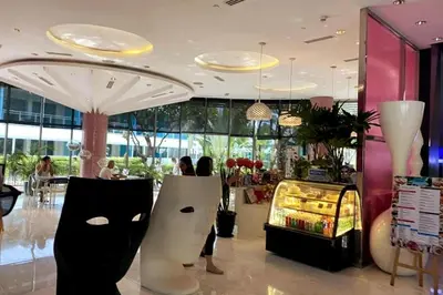 a store with a shark chair in a mall at Azure 1BR citylights with netlfix near airport in Manila