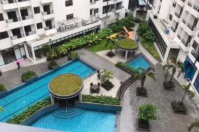 an overhead view of a swimming pool in a building at Bicutan Urban Haven in Manila