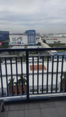 a view of a city from a balcony at S Residences in Manila