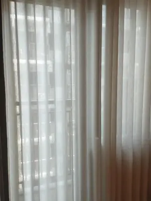 a black and white photo of a white curtain at S Residences in Manila