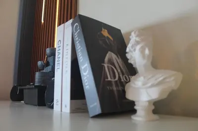 a book sitting on a table next to a statue at EL MEIR PRIME CABIN w/ Bathtub near EK in Santa Rosa